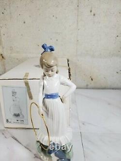 1989 NAO by Lladro Porcelain Figurine Nina con aro y perrito No. 379 dog