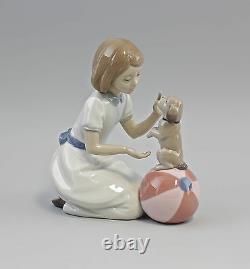 9956122 New Trick Girl with Puppy on Ball Nao Lladro Spain 17x20cm