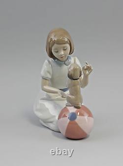 9956122 a New Trick Girl with Puppy on Ball Nao Lladro Spain 17x20cm