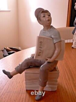 A Stunning Lladro / Nao Newspaper Boy Figure