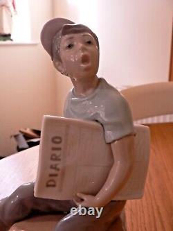 A Stunning Lladro / Nao Newspaper Boy Figure