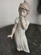 A lovely looking NAO/lladro tall /girl china figure /