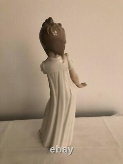 A lovely looking NAO/lladro tall /girl china figure /