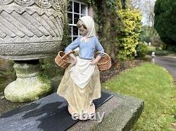 Large Nao/Lladro Gres figure of a lady carrying baskets, H38cm