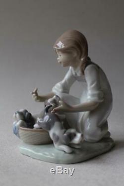 Lladro 5595 Girl with puppies in a basket'Joy in a Basket