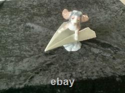 Lladro Dog on a paper plane