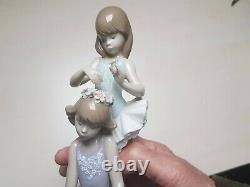 Lladro'First Ballet' No 5714. Girl ballerinas with flowers