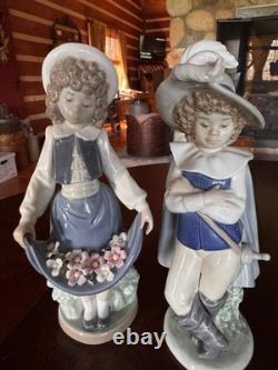 Lladró NAO Figurines Set 01005 Girl with Flowers & 01043 Musketeer Boy with Boxes