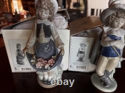 Lladró NAO Figurines Set 01005 Girl with Flowers & 01043 Musketeer Boy with Boxes