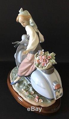 Lladro Scooting. 5143. Country girl with motorcycle. 10.75'