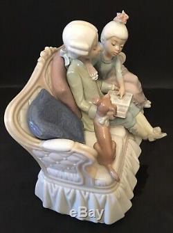 Lladro Story Time. 5229. Children reading with dog on sofa