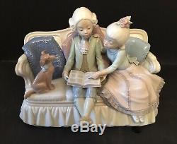 Lladro Story Time. 5229. Children reading with dog on sofa