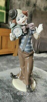 Lladro clown figurine carrying an alarm clock 5056