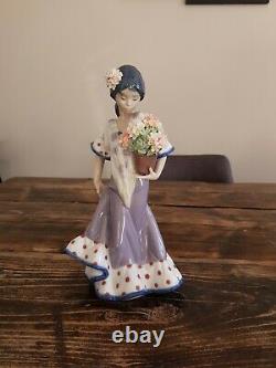 Lladro figurines with flowers 5490