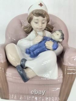 NAO BY LLADRO GIRL PLAYING NURSE/ #1055 On CHAIR HOLDING DOLL, Box, No Insert