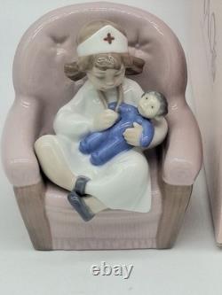 NAO BY LLADRO GIRL PLAYING NURSE/ #1055 On CHAIR HOLDING DOLL, Box, No Insert
