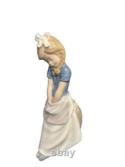 NAO Lladro 0480 Thinkin' girl with braids and hands in apron