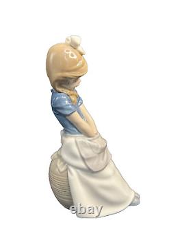 NAO Lladro 0480 Thinkin' girl with braids and hands in apron