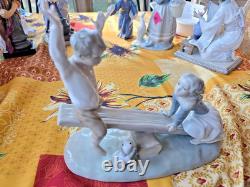 NAO Lladro Spain Bisque Porcelain Boy and Girl on Seesaw with Dog #4867