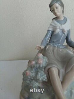 NAO by Lladro Figurine Girl Resting on a Log with a Hat