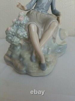 NAO by Lladro Figurine Girl Resting on a Log with a Hat