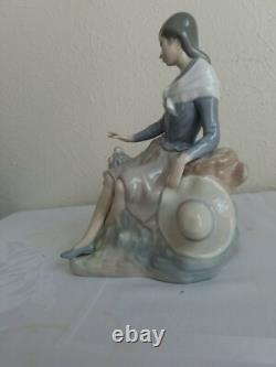 NAO by Lladro Figurine Girl Resting on a Log with a Hat