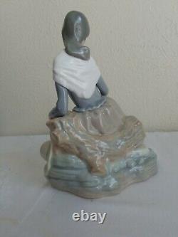 NAO by Lladro Figurine Girl Resting on a Log with a Hat