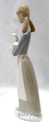 NAO by Lladro' Girl Holding a Duck Figure 10.75 in Tall Minor Defect