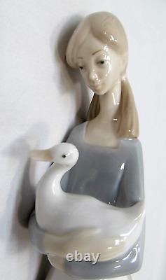 NAO by Lladro' Girl Holding a Duck Figure 10.75 in Tall Minor Defect