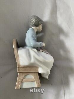 NAO by Lladro RARE Counting Stitches Girl Embroidering Figure. Pre-owned