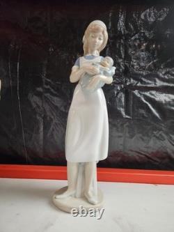 Nao Sports and Careers Nurse Holding Baby Figurine