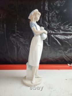 Nao Sports and Careers Nurse Holding Baby Figurine