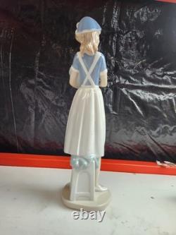 Nao Sports and Careers Nurse Holding Baby Figurine