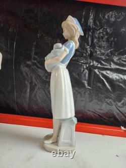Nao Sports and Careers Nurse Holding Baby Figurine