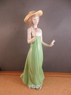 Nao by Lladro Gentle Breeze Figurine (Special Edition) Girl Green Single Flower