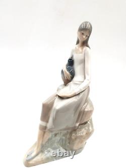 Nao by Lladro Girl Sitting On the Rock With Jug 24.2 cm (9.5) Porcelain Figure