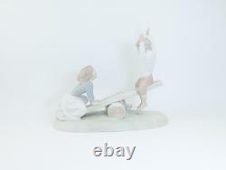 Nao by Lladro Porcelain Figurine Children, Dog on Seesaw, Matte Finish