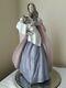 Nao by Lladro pottery figure of a Lady holding a baby in a blanket 13 1/4 inches