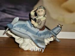 RETIRED Lladro OVER THE CLOUDS 5697 BOY AIRPLANE BIRDS SKY