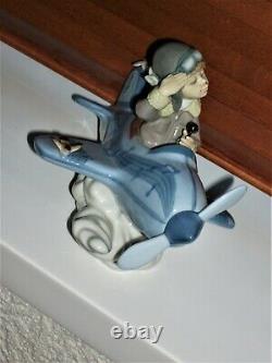 RETIRED Lladro OVER THE CLOUDS 5697 BOY AIRPLANE BIRDS SKY