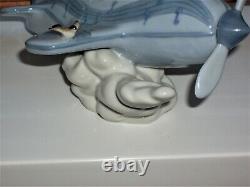 RETIRED Lladro OVER THE CLOUDS 5697 BOY AIRPLANE BIRDS SKY