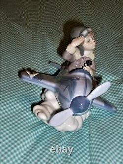 RETIRED Lladro OVER THE CLOUDS 5697 BOY AIRPLANE BIRDS SKY