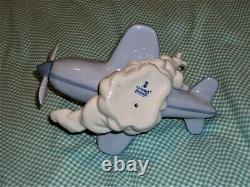 RETIRED Lladro OVER THE CLOUDS 5697 BOY AIRPLANE BIRDS SKY