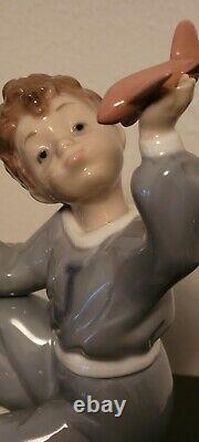 RETIRED NAO LLADRO JET PILOT #1133 BOY w TOY PLANE AIRPLANE PORCELAIN FIGURINE