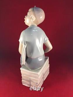 Vintage Lladro Nao Spain Boy Sitting on Newspapers Papers Figurine Figure