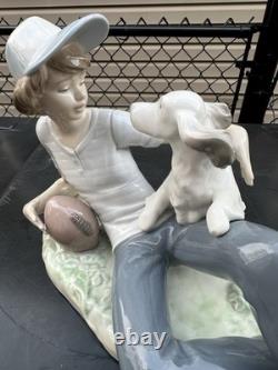 Vintage Nao by Lladro porcelain figurine titled Boy With Dog And Football 1985