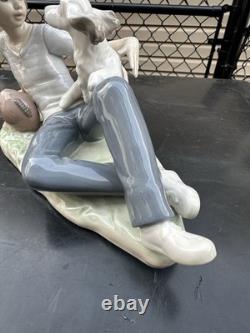 Vintage Nao by Lladro porcelain figurine titled Boy With Dog And Football 1985