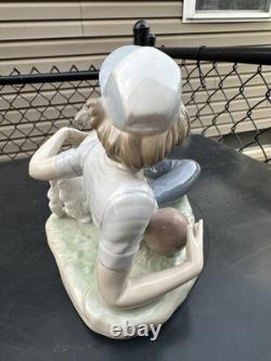 Vintage Nao by Lladro porcelain figurine titled Boy With Dog And Football 1985