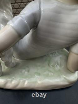 Vintage Nao by Lladro porcelain figurine titled Boy With Dog And Football 1985