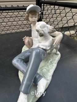 Vintage Nao by Lladro porcelain figurine titled Boy With Dog And Football 1985